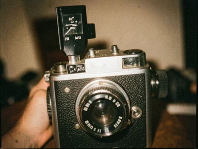 Film advance lever and frame counter on top plate of rangefinder camera