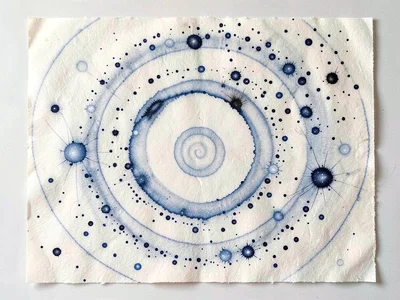A field of distant galaxies as scattered ink droplets of varying density on pale