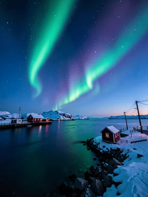 Polar night blue hour in Tromso, Norway, aurora borealis photographed at long ex