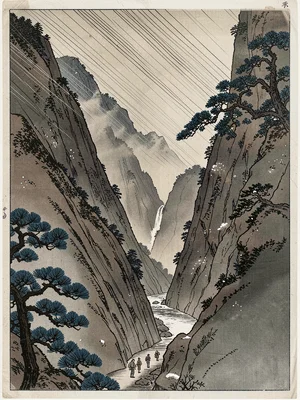 Narrow mountain path between overhanging cliffs, waterfall visible at end of the