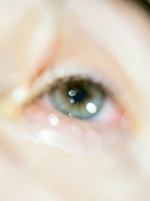 Eye close-up with catchlight, rest falling away
