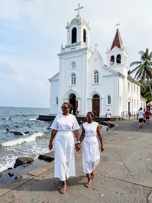 Sunday stillness in Nuku'alofa, Tonga, A mother and daughter in matching white S