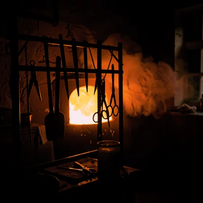 Tool Rack Silhouettes Against Furnace