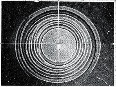 Moiré interference pattern from photocopying a halftone newspaper image, concent