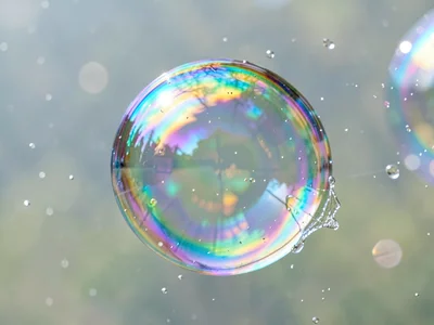 Single perfect sphere on film surface