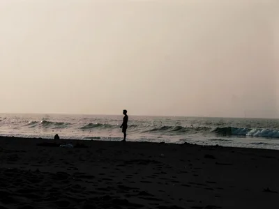 Beach silhouette with haze