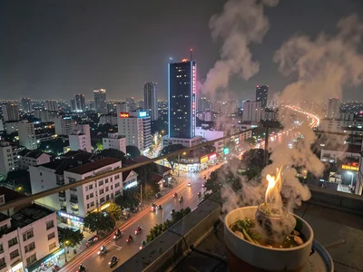 District 1 rooftop view with motorbike rivers