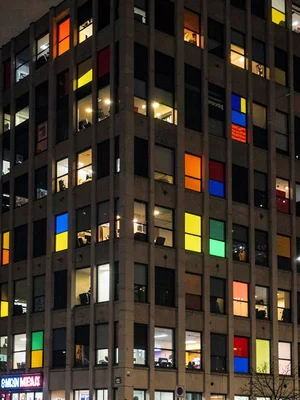 Office building at night, random lit windows making unintentional Mondrian