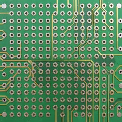 A close-up of a BGA component pad array on a PCB — hundreds of solder ball pads 