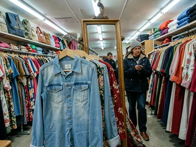 Hold up to body check, mirror in aisle, imagining the outfit possibility