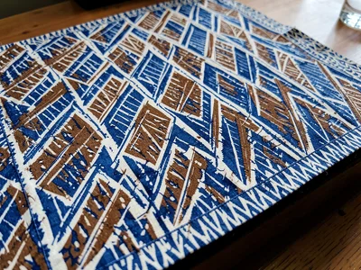 A finished batik parang motif cloth — repeating diagonal knife-blade forms in in
