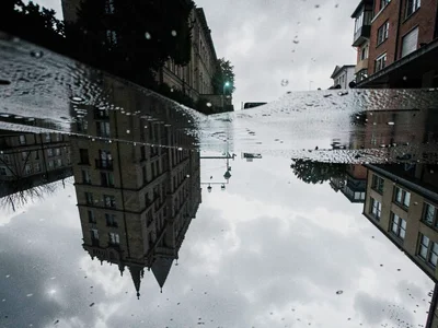 Building silhouette in rainy reflection