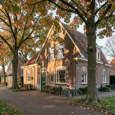 a Dutch farmhouse at clear morning, brick gable warmed by sun, a single bicycle