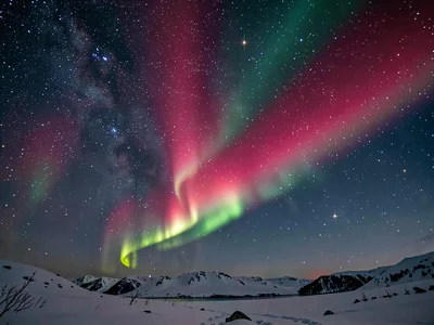 Rare red aurora at high altitude against stars