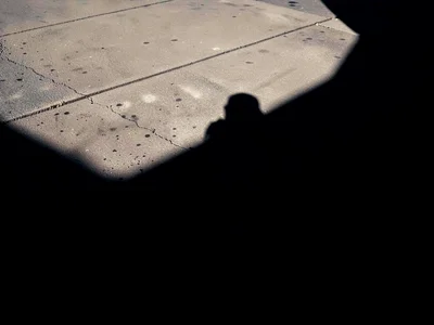 Noon shadow compressed beneath