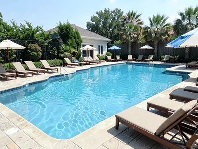 Swimming pool with loungers