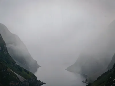 Fjord turn disappearing into continuous gray