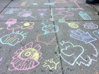 A collaborative chalk mural: different sections clearly by different hands, diff