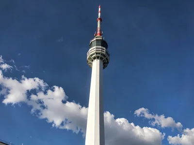 Cloud base dark against white tower