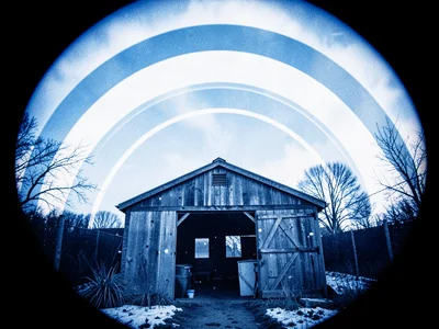 An allotment shed with sun arcs above — winter low, summer high, months between