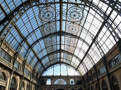 Glass ceiling of train station, Victorian ironwork making mandalas of the sky