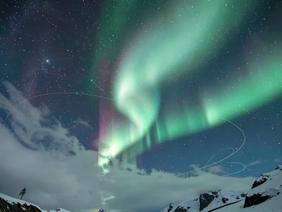 Aurora through thin cloud creating diffuse glow
