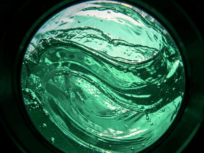 Ocean water surface texture from just above — wind ripples and larger swells cre