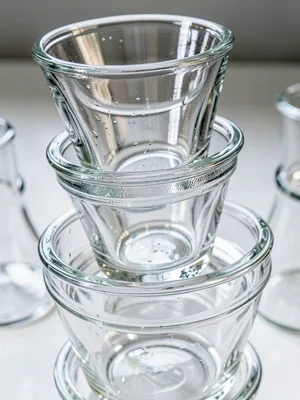 Drinking glasses stacked, nested transparency, everyday glass architecture