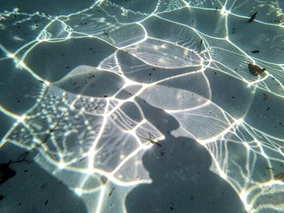 Shadow and light interference creating moire underwater