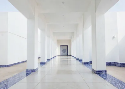 Extreme minimalist restraint of Muscat, Oman, prayer hall interior, white column