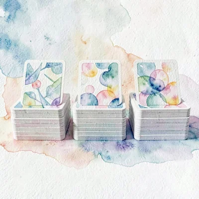 A card-deck stacked layout of three card piles in a row with the top card of eac