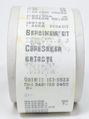 Receipt paper roll with spring garden checklist printed, curling at edges