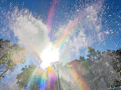 Spectrum visible in water spray backlit by sun