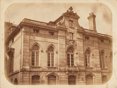 A Victorian architectural study — stone facade with arched windows, warm sepia t