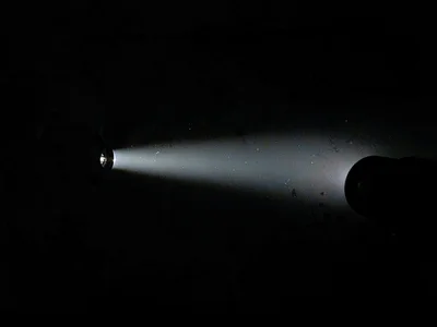 Flashlight beam in dark space