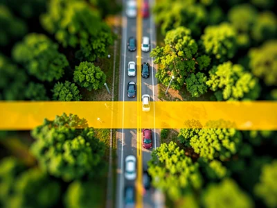 Cloverleaf tilt-shift photograph from helicopter altitude, saturated honey-yello