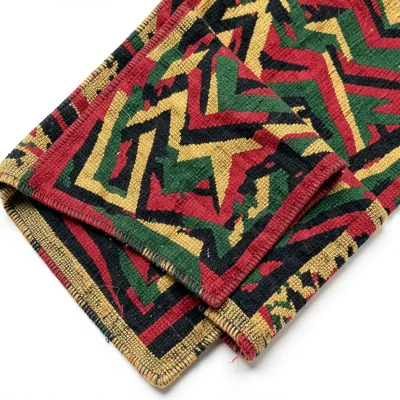 Kente strip folded accordion-style — geometric pattern in layered zigzag view