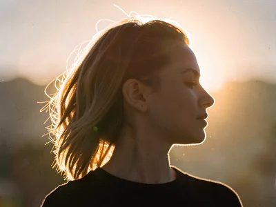 Hair backlit creating golden aureole