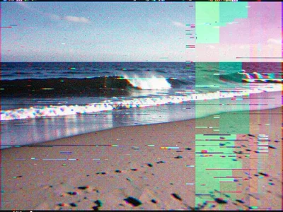 Corrupted beach photograph with shifted RGB channels, wave becoming abstract