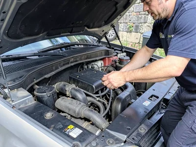 Mechanics under car hood
