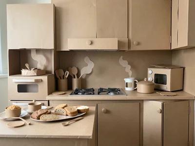 Kitchen scene made entirely of paper — paper food, paper appliances, paper steam