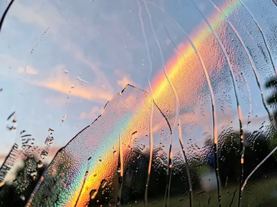 Sunrise through textured glass creating dispersed color