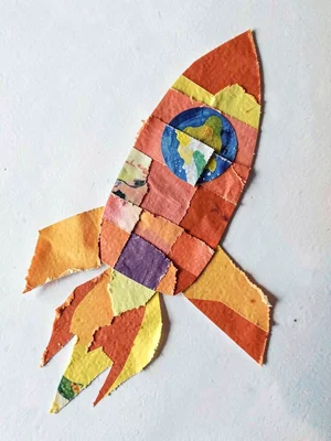 Paper collage rocket with flames