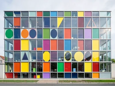 Glass building facade — repeating rectangle grid with primary color window panel
