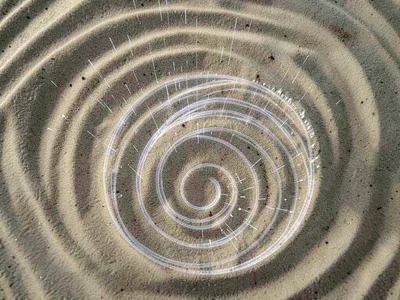 Sand pattern showing transformation as frequency sweeps higher