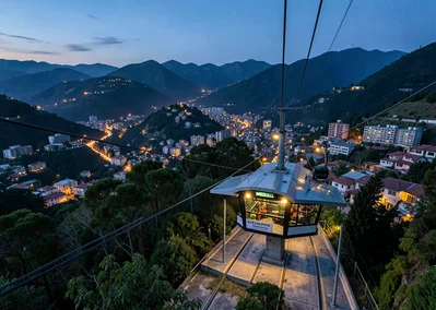 Eternal spring light over transforming Medellín, metro cable station at dusk, wa