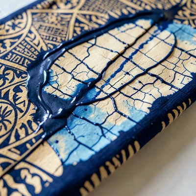 Close-up of crackle lines in a batik cloth where the wax cracked before dyeing, 