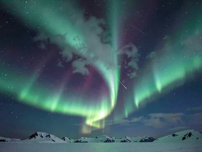 Aurora through thin cloud creating diffuse glow