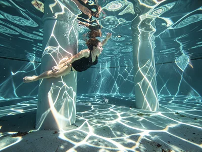 Pool diving through caustic column
