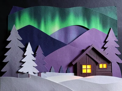 A Northern Lights scene: dark sky with aurora in green and purple paper layers, 